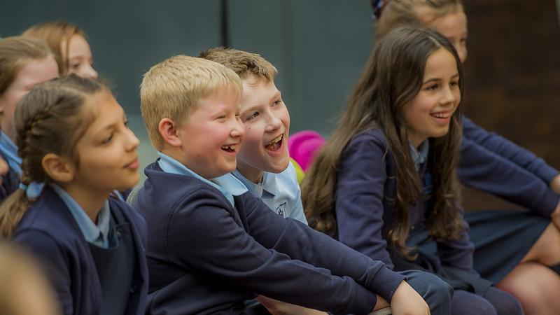 primary school pupils smiling and laughing