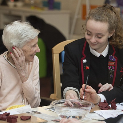 Whitburn academy pupil with woman from Whitdale Care Home
