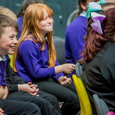 primary school pupils smiling and laughing